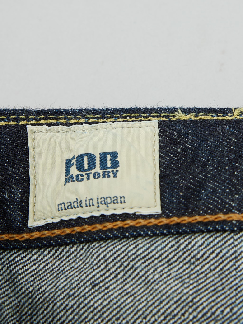 Fob factory slim straight denim jeans brand tag