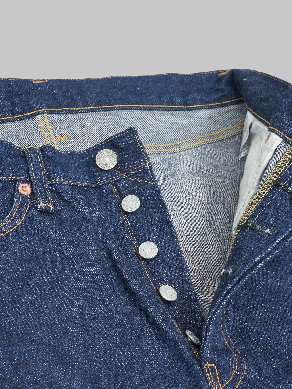 Studio D'Artisan natural indigo jeans buttons detail