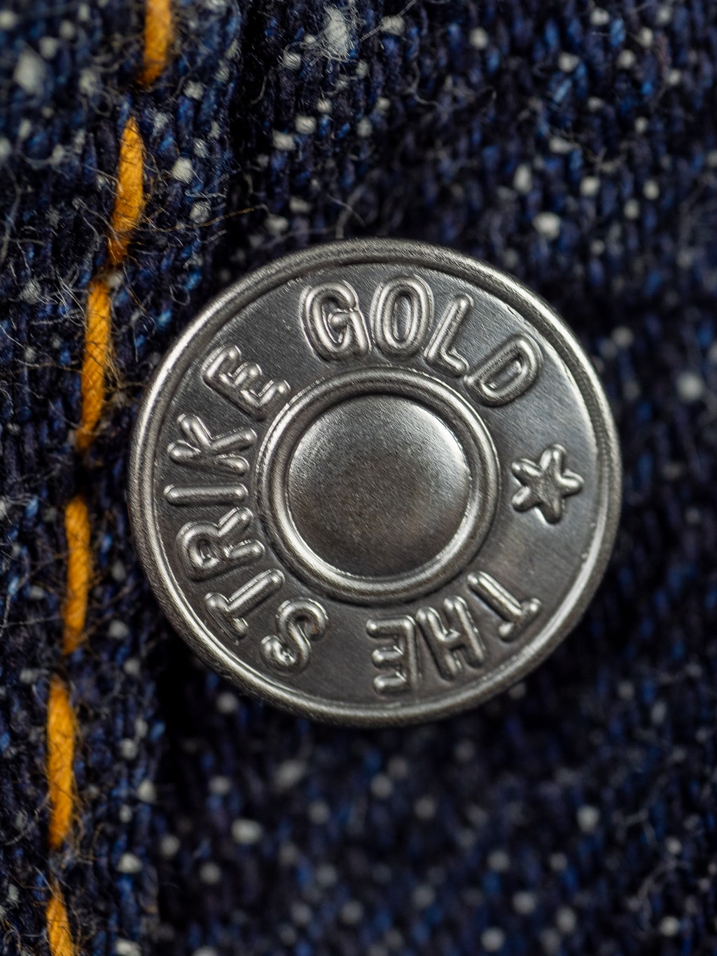 The Strike Gold 0103KE Keep Earth Jeans button closeup