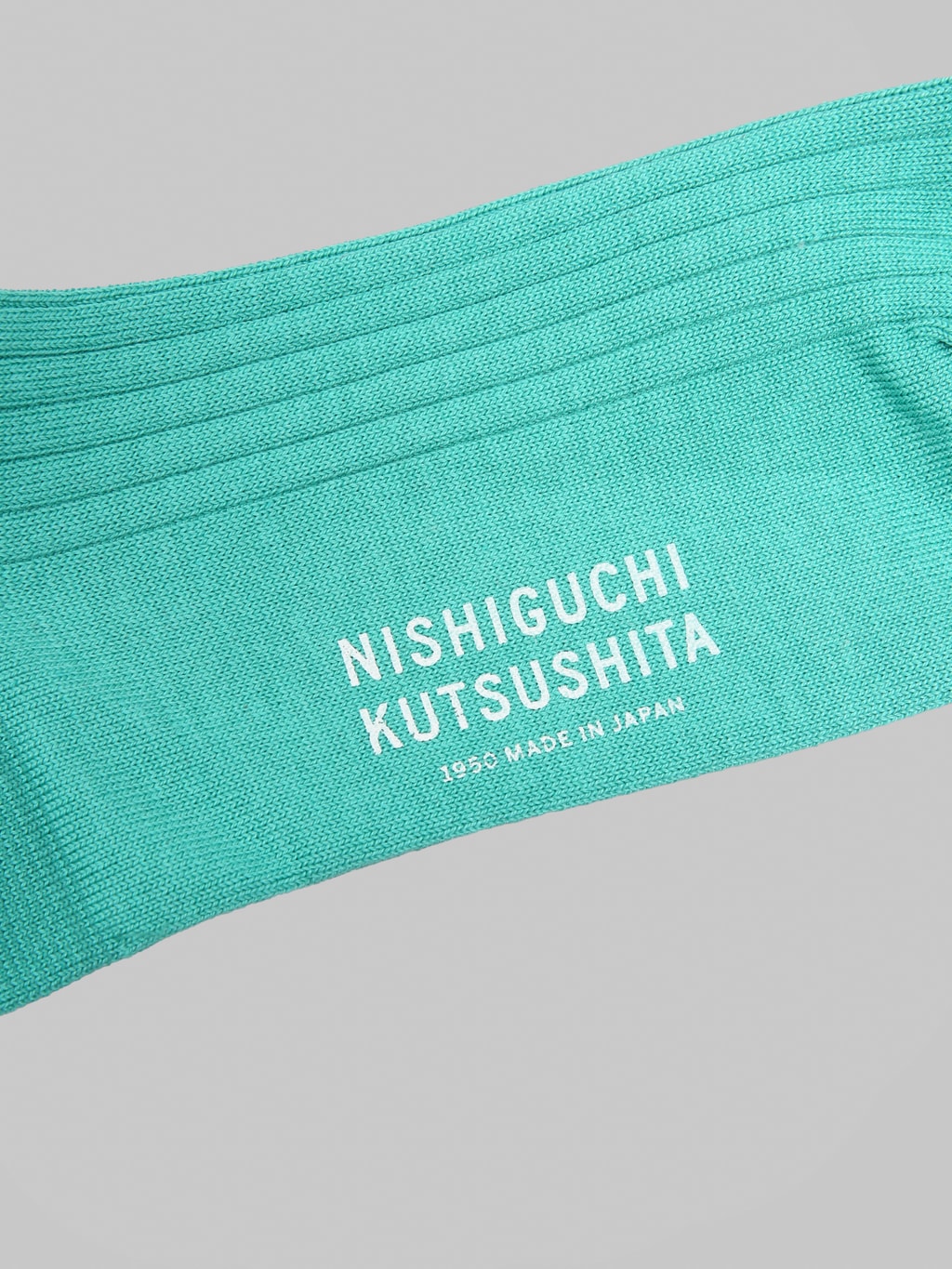 Nishiguchi Kutsushita Silk Cotton Ribbed Socks Cast Iron Railings logo