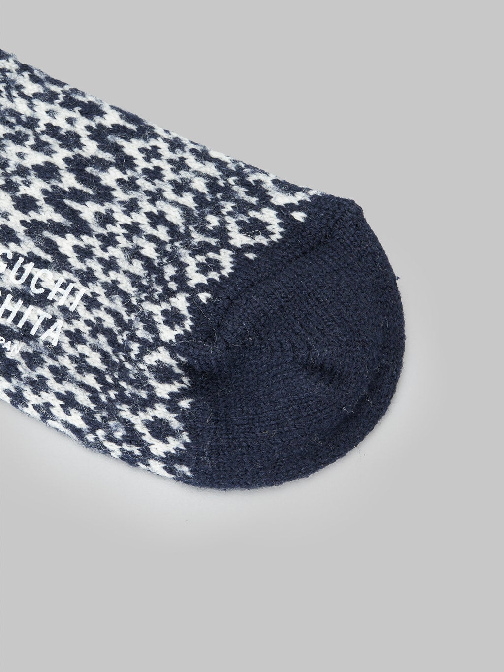 Nishiguchi Kutsushita Wool Jacquard Socks Berlin Blue fabric texture