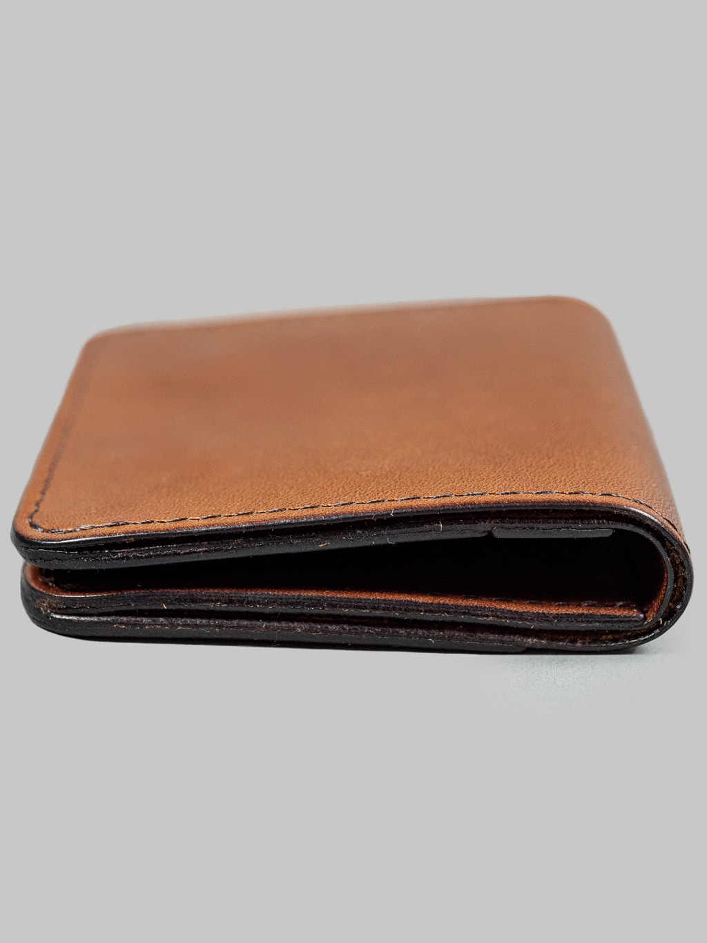 Studio Dartisan brown leather mini wallet side view