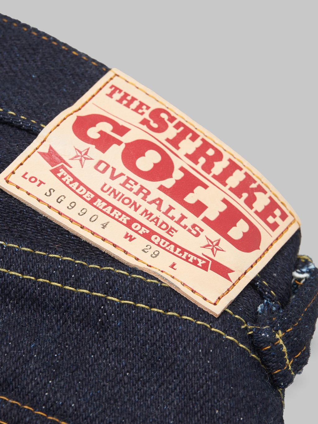The Strike Gold Extra Heavyweight straight tapered jeans brand patch