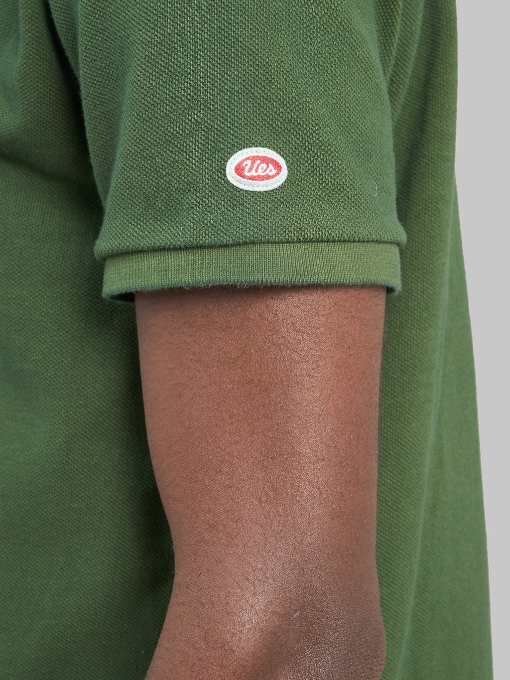ues polo shirt green logo