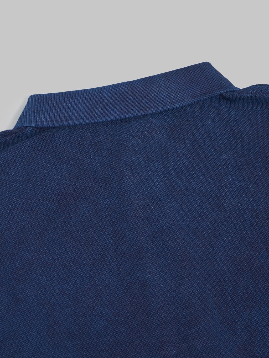 ues polo shirt indigo back collar detail