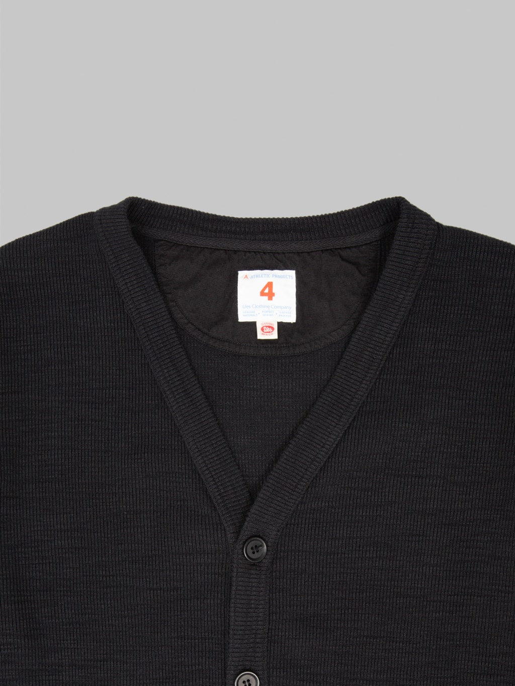 UES Single Rib Cardigan Black tag