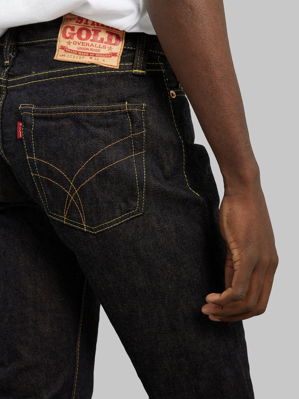 The Strike Gold Brown Weft Slim Jeans pocket stitching