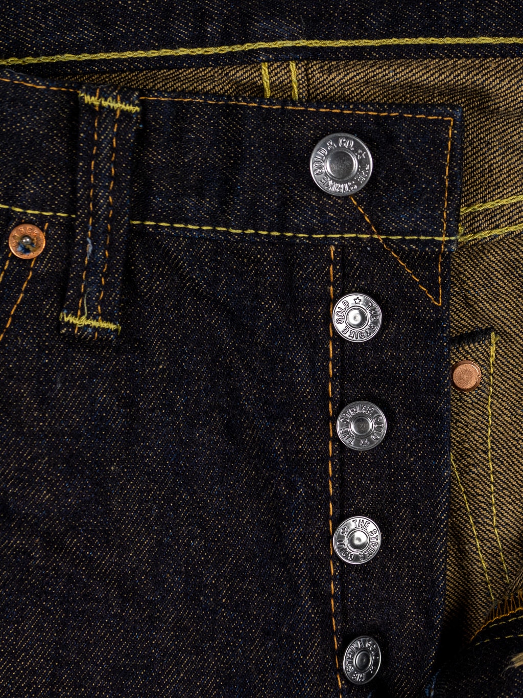 The Strike Gold Brown Weft Slim Jeans iron buttons