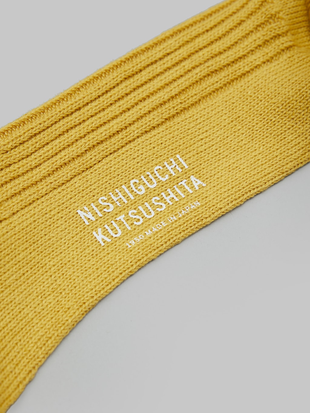 nishiguchi kutsushita linen ribbed socks canary yellow brand stamped logo