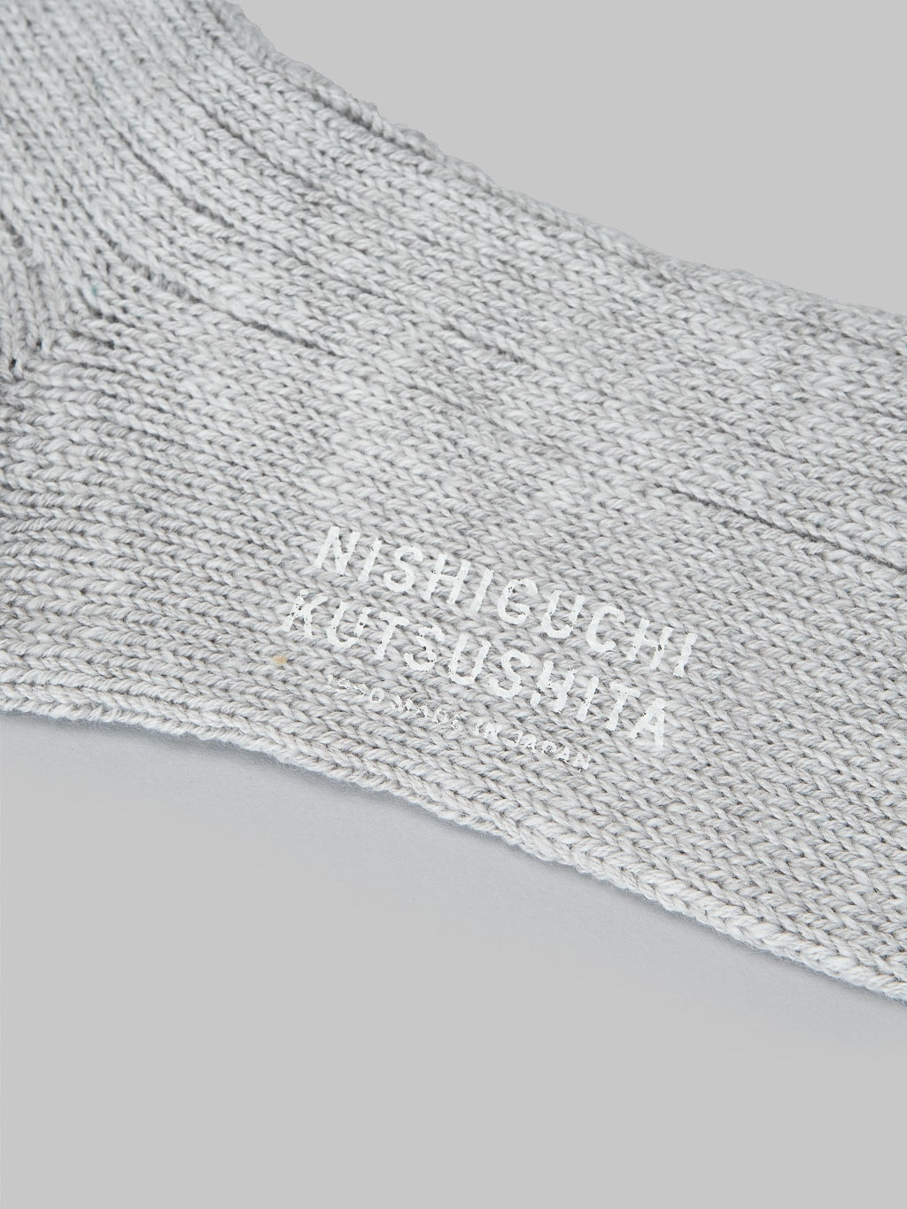 Nishiguchi Kutsushita Wool Cotton Slab Socks Green Brand Logo