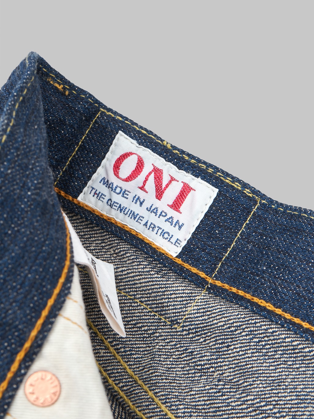 Oni denim kiwami indigo regular selvedge jeans brand logo tag
