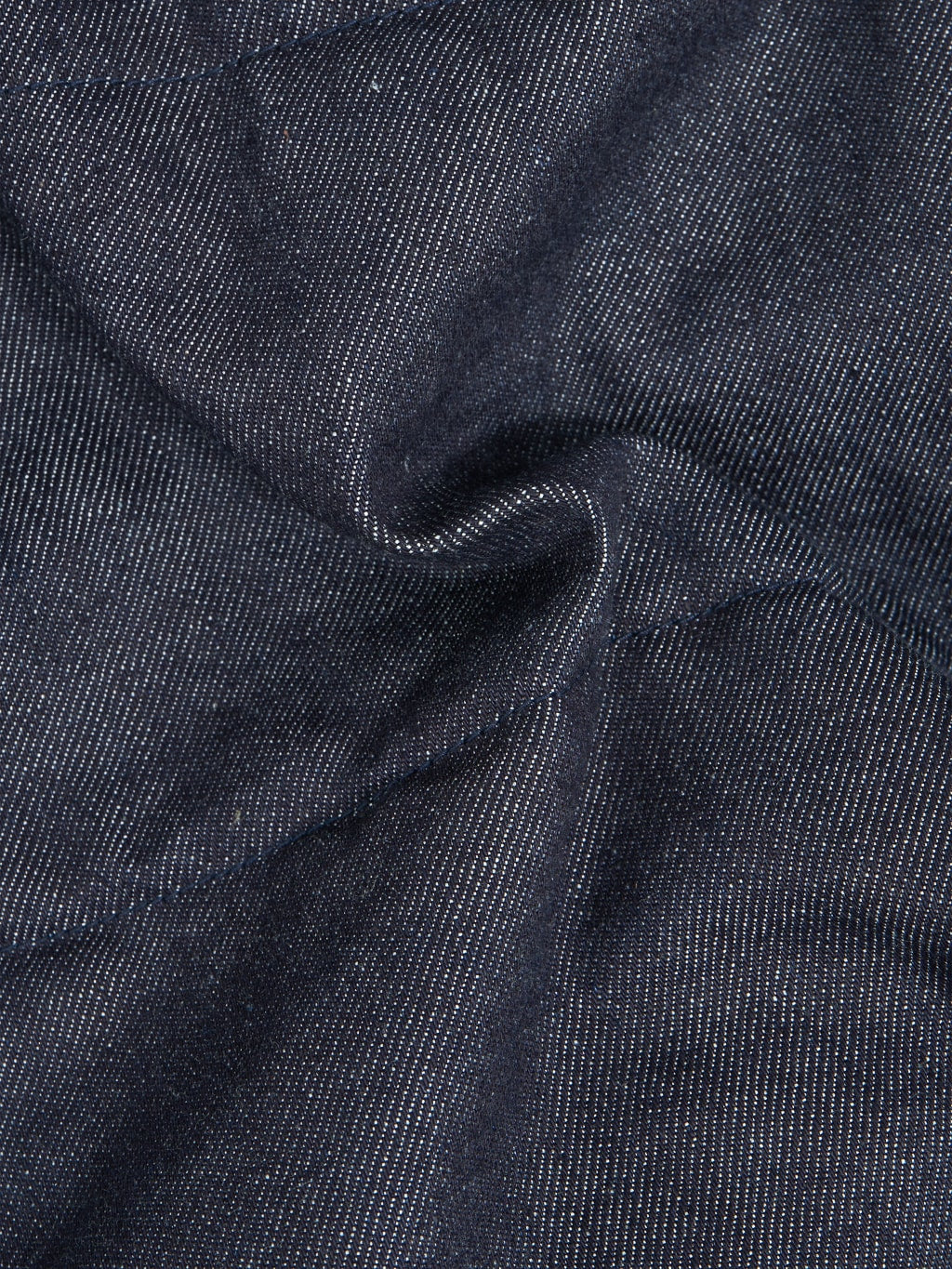 The Flat Head Denim Puffer Jacket texture