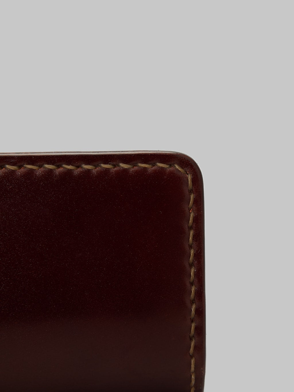 The Flat Head handsewn small cordovan card case brown fabric closeup