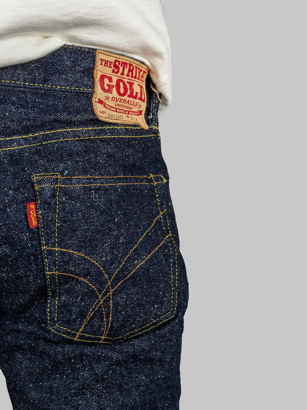 The Strike Gold Keep Earth Natural Indigo Jeans back pocket