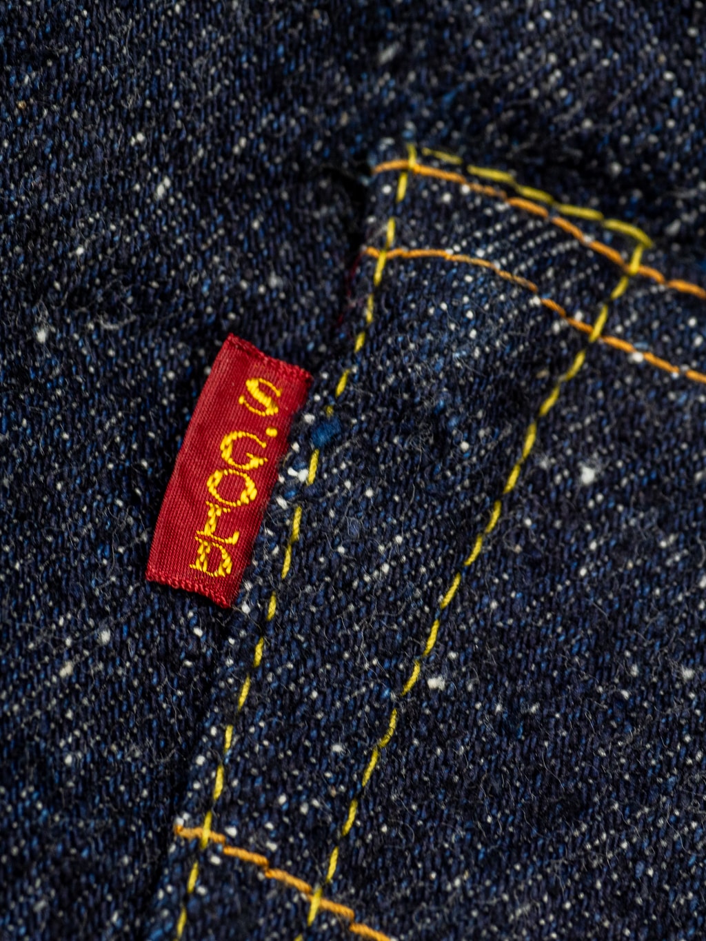 The Strike Gold Keep Earth Natural Indigo Jeans brand red tab