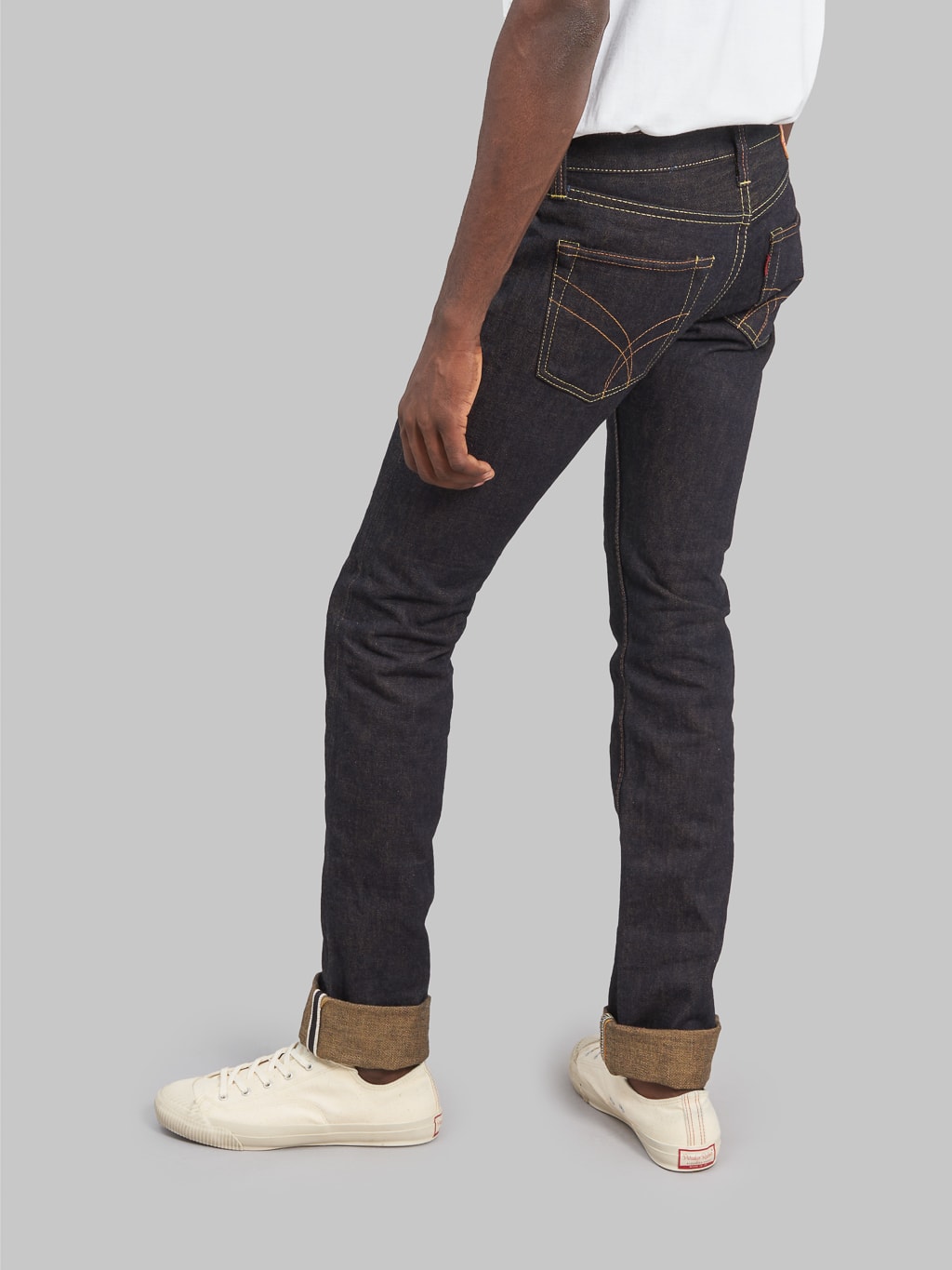 The Strike Gold Brown Weft Slim Tapered Jeans back fit