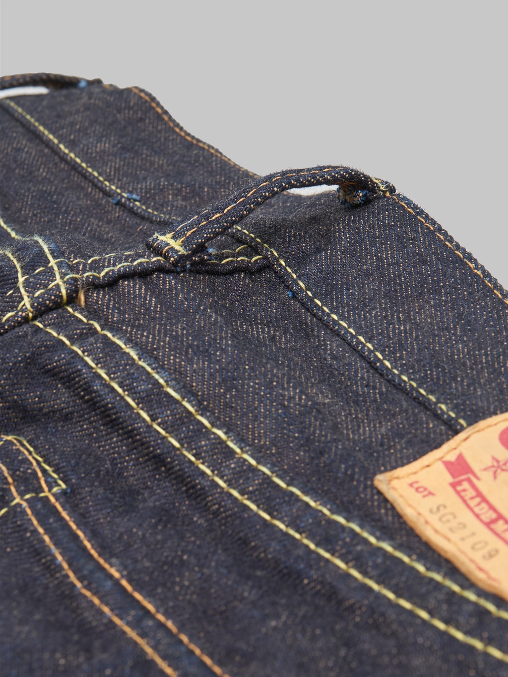 The Strike Gold Brown Weft Slim Tapered Jeans belt loop