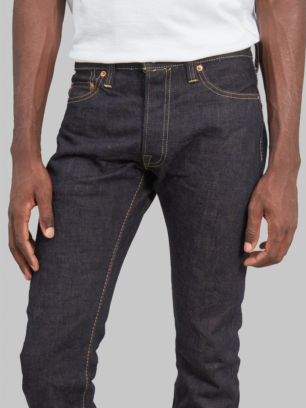 The Strike Gold Brown Weft Slim Tapered Jeans front rise