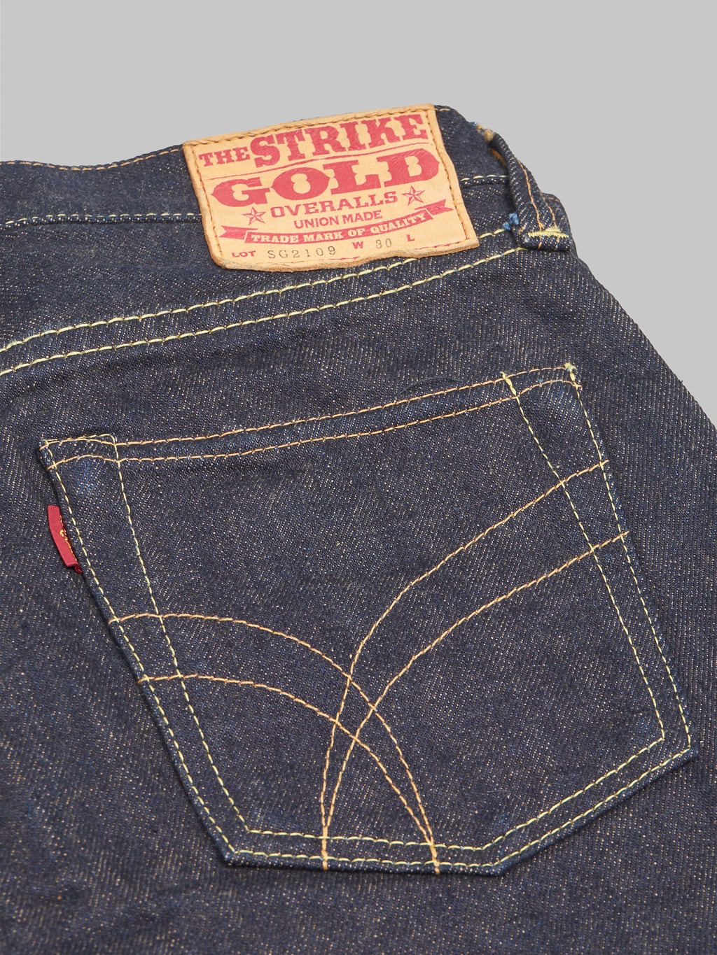 The Strike Gold Brown Weft Slim Tapered Jeans pocket design