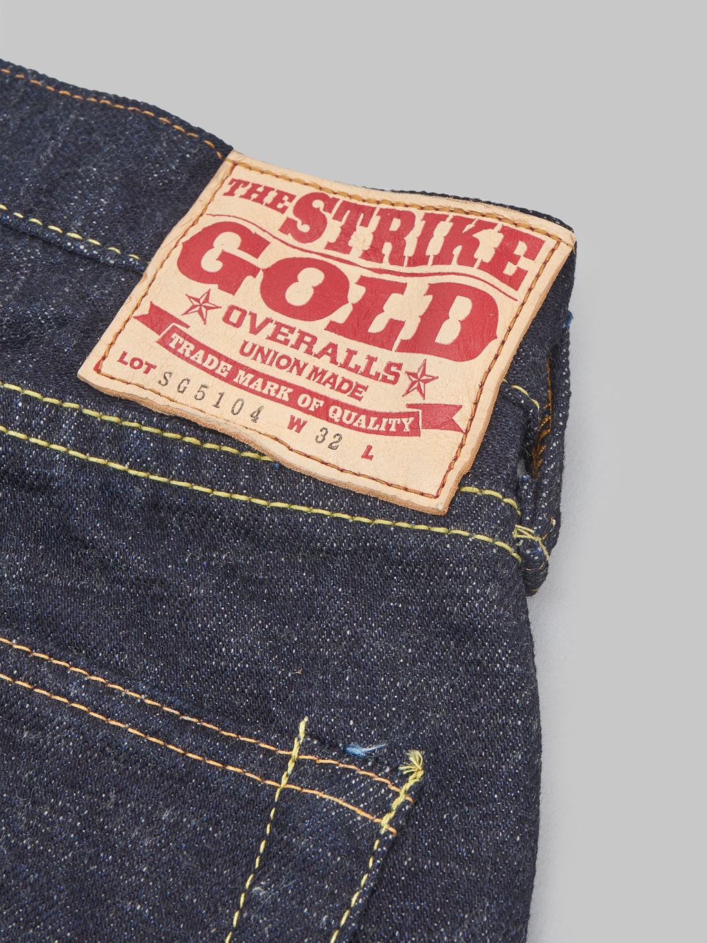 The Strike Gold 5104 Slub Grey Weft Straight Tapered Jeans leather patch