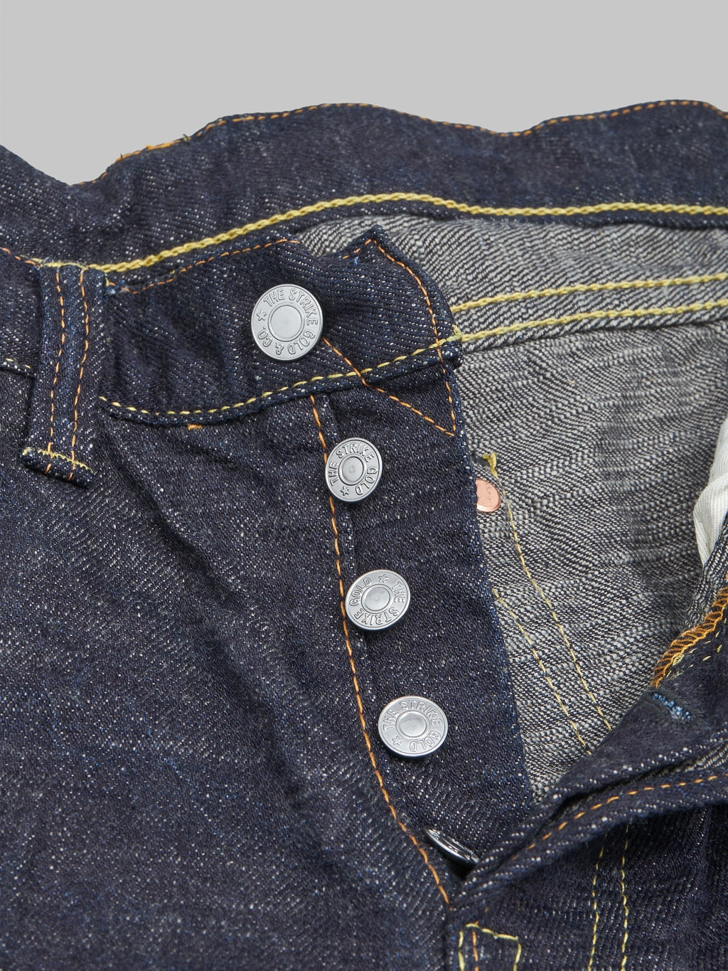 The Strike Gold 5109 15oz Slub Grey Weft Slim Tapered Jeans buttons