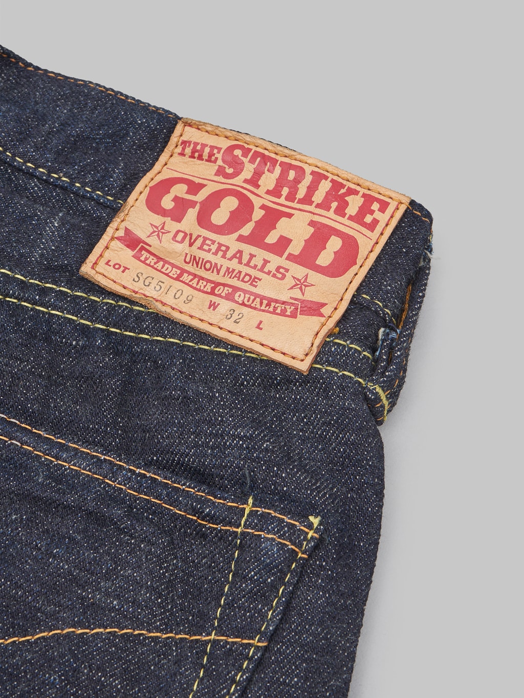 The Strike Gold 5109 15oz Slub Grey Weft Slim Tapered Jeans patch