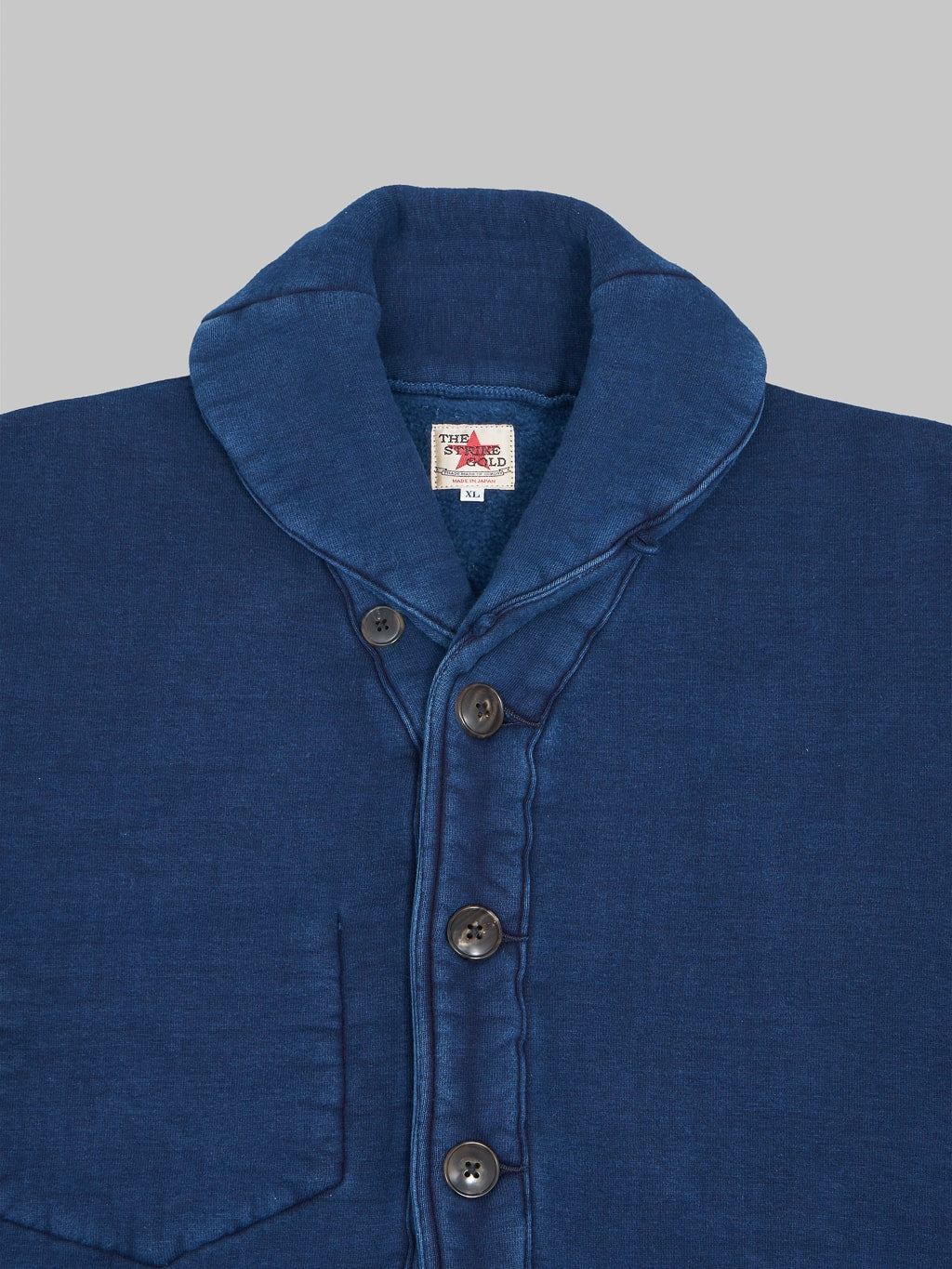 the strike gold indigo cardigan chest buttons