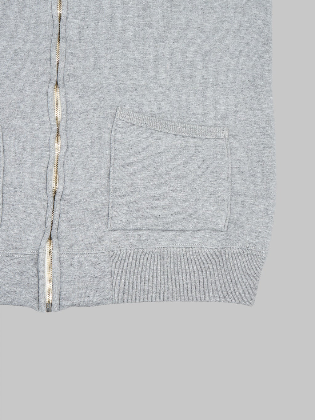 the strike gold zip hoodie grey front pockets