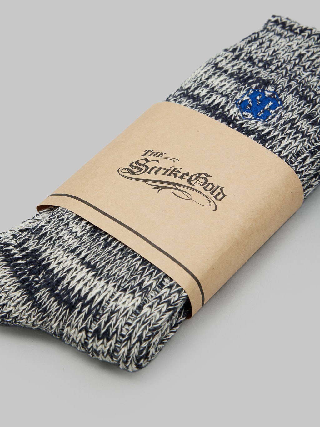 The Strike Gold Remnant Yarn Socks Navy brand label