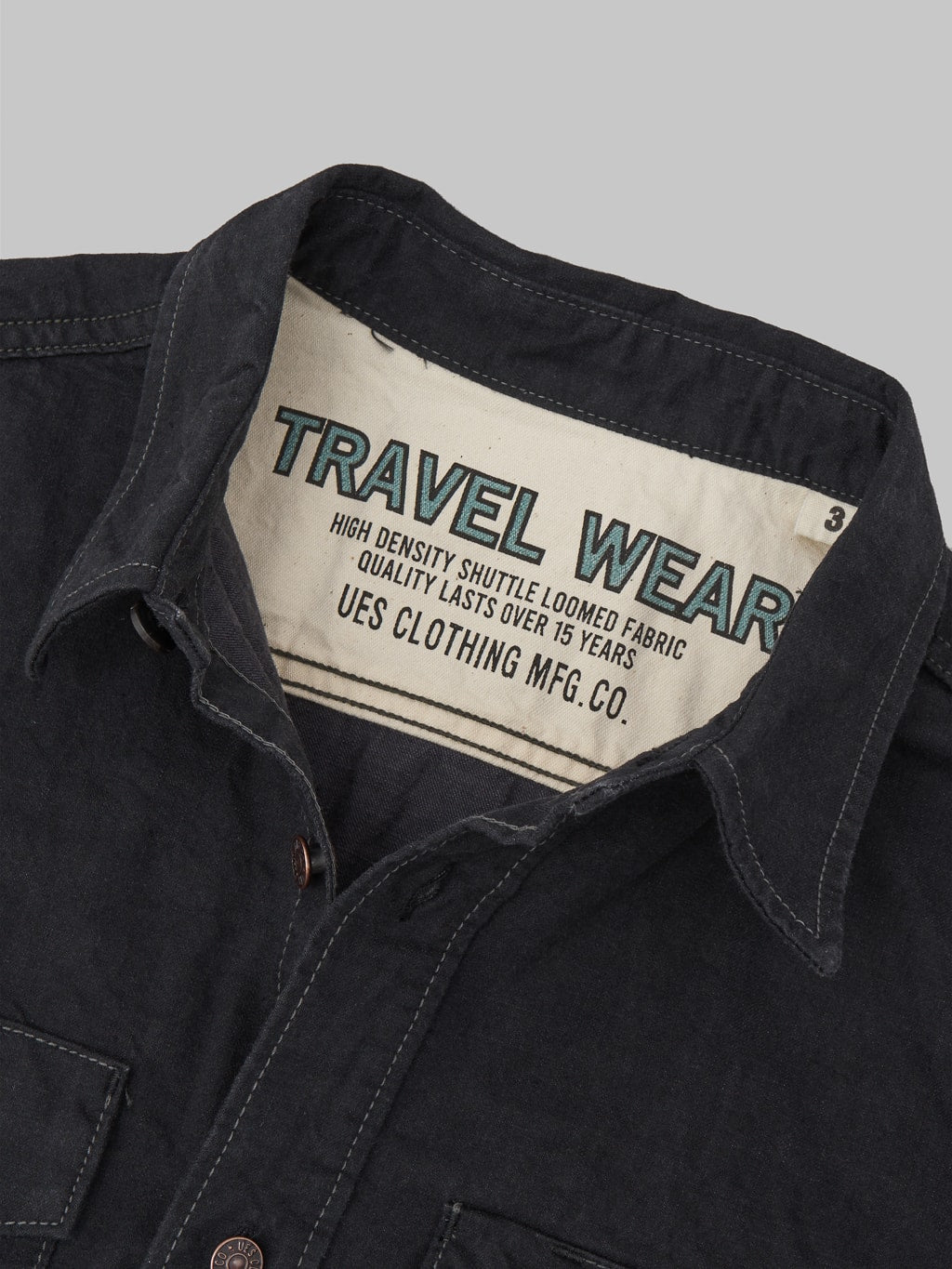 UES traveling shirt black interior brand tag