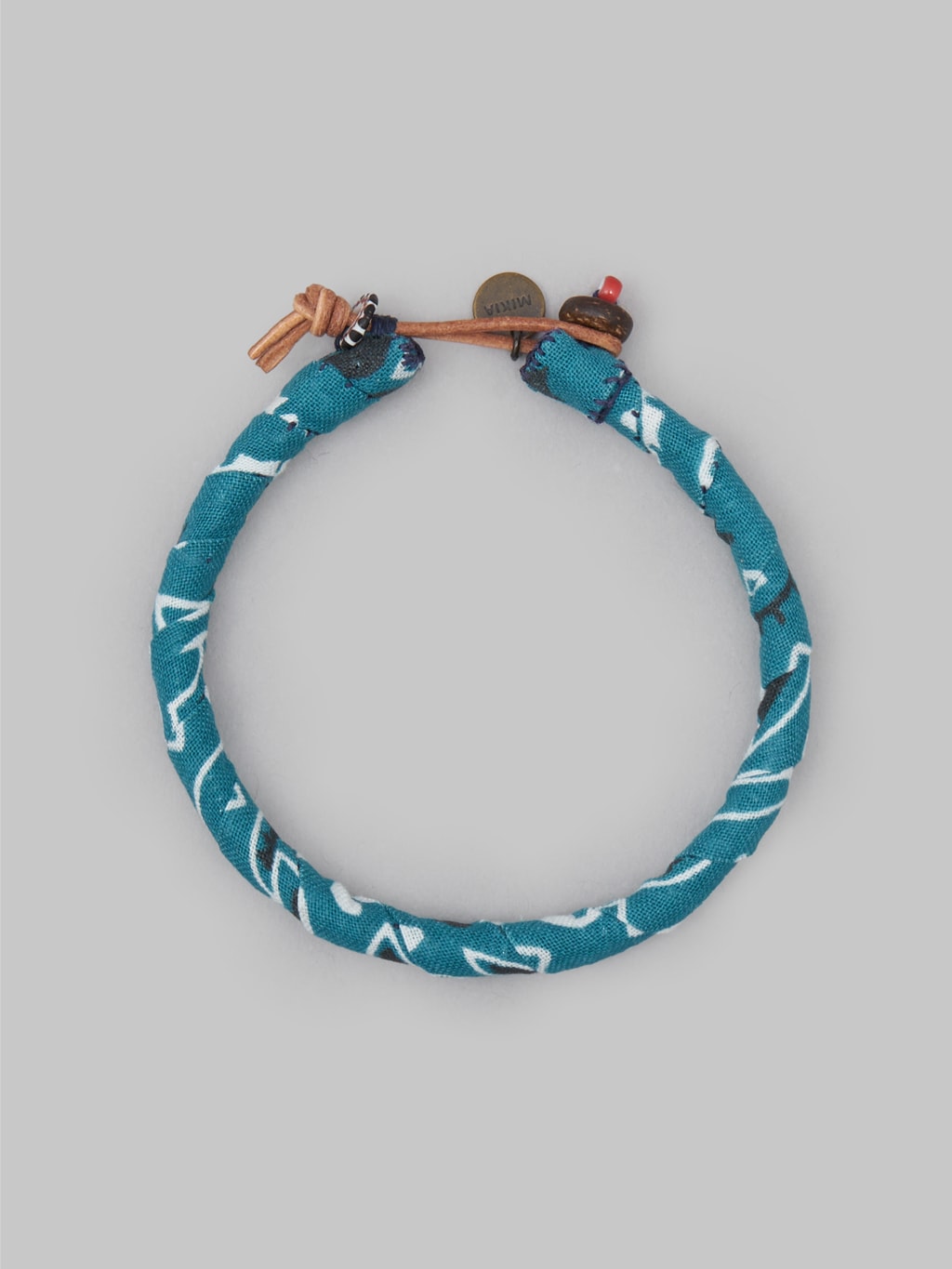 mikia bandana bracelet blue green  coconut button