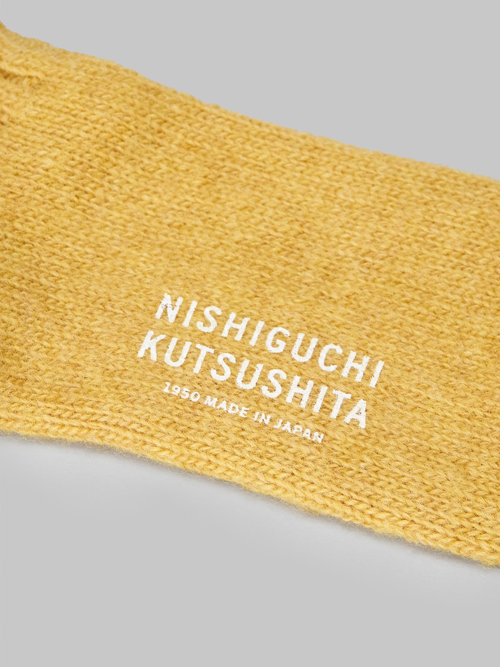 nishiguchi kutsushita wool ribbed socks apple soda brand logo stamped