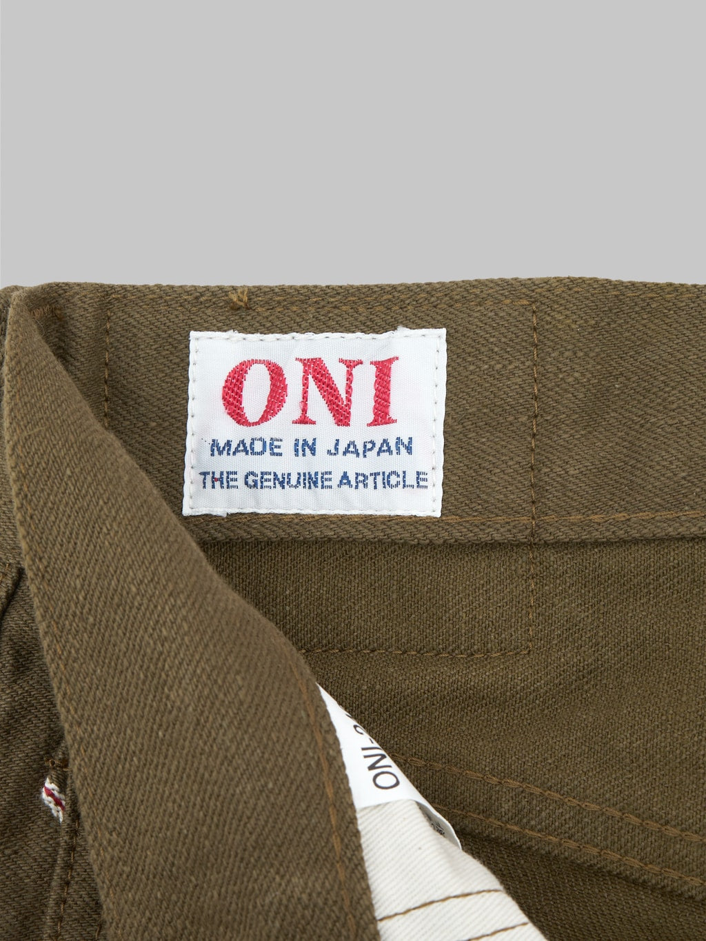 oni 246 olive warp and weft neat straight selvedge jeans interior tag