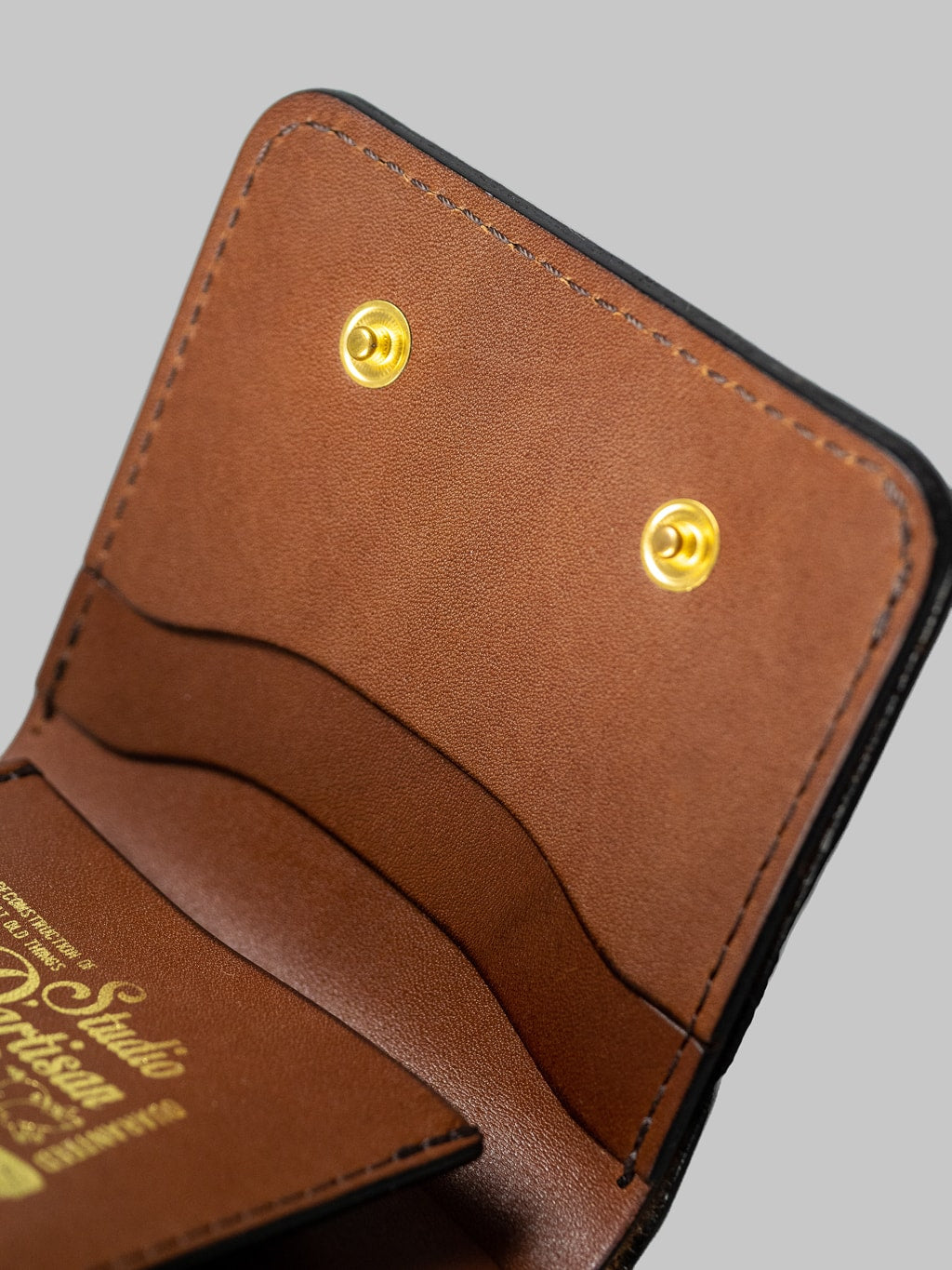 Studio Dartisan brown leather mini wallet button detail