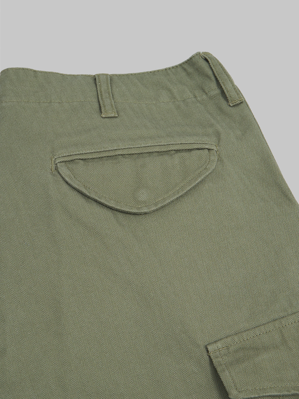 tanuki herringbone m65 pants green fabric closeup