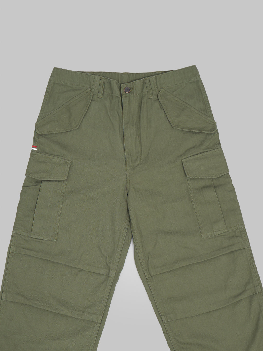 tanuki herringbone m65 pants green front details