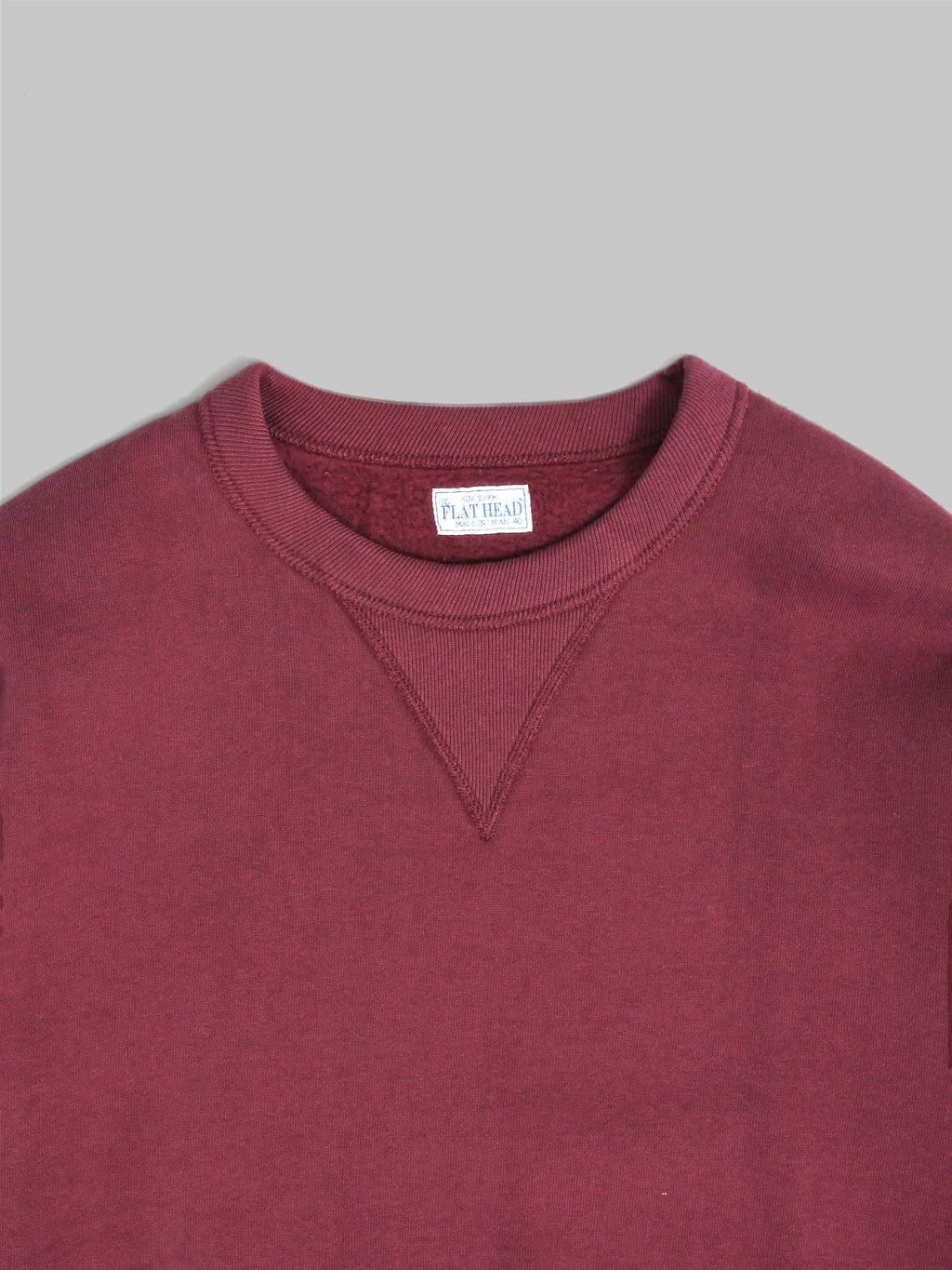 the flat head loopwheel crewneck sweatshirt engine red collar