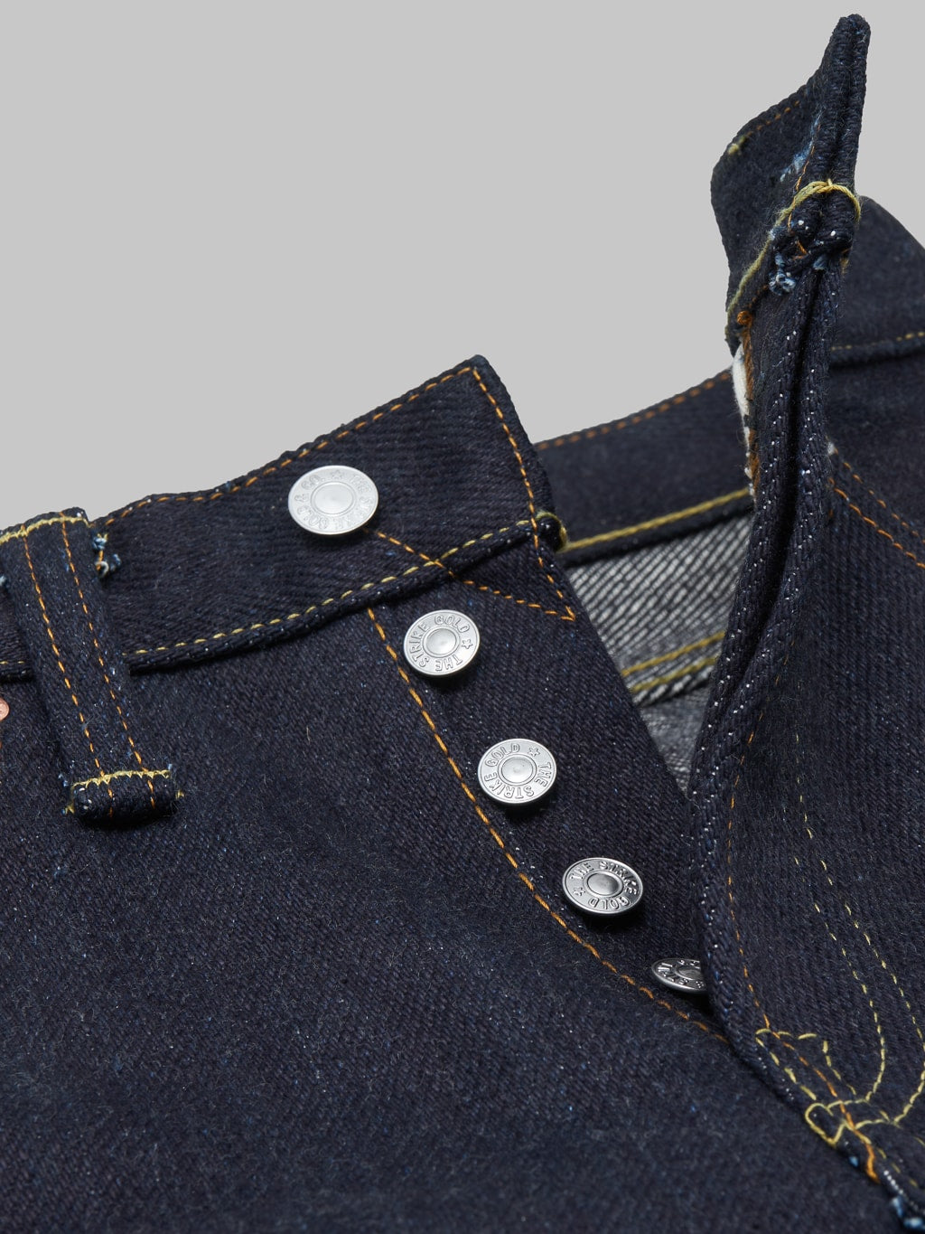 The Strike Gold Extra Heavyweight straight tapered jeans button details