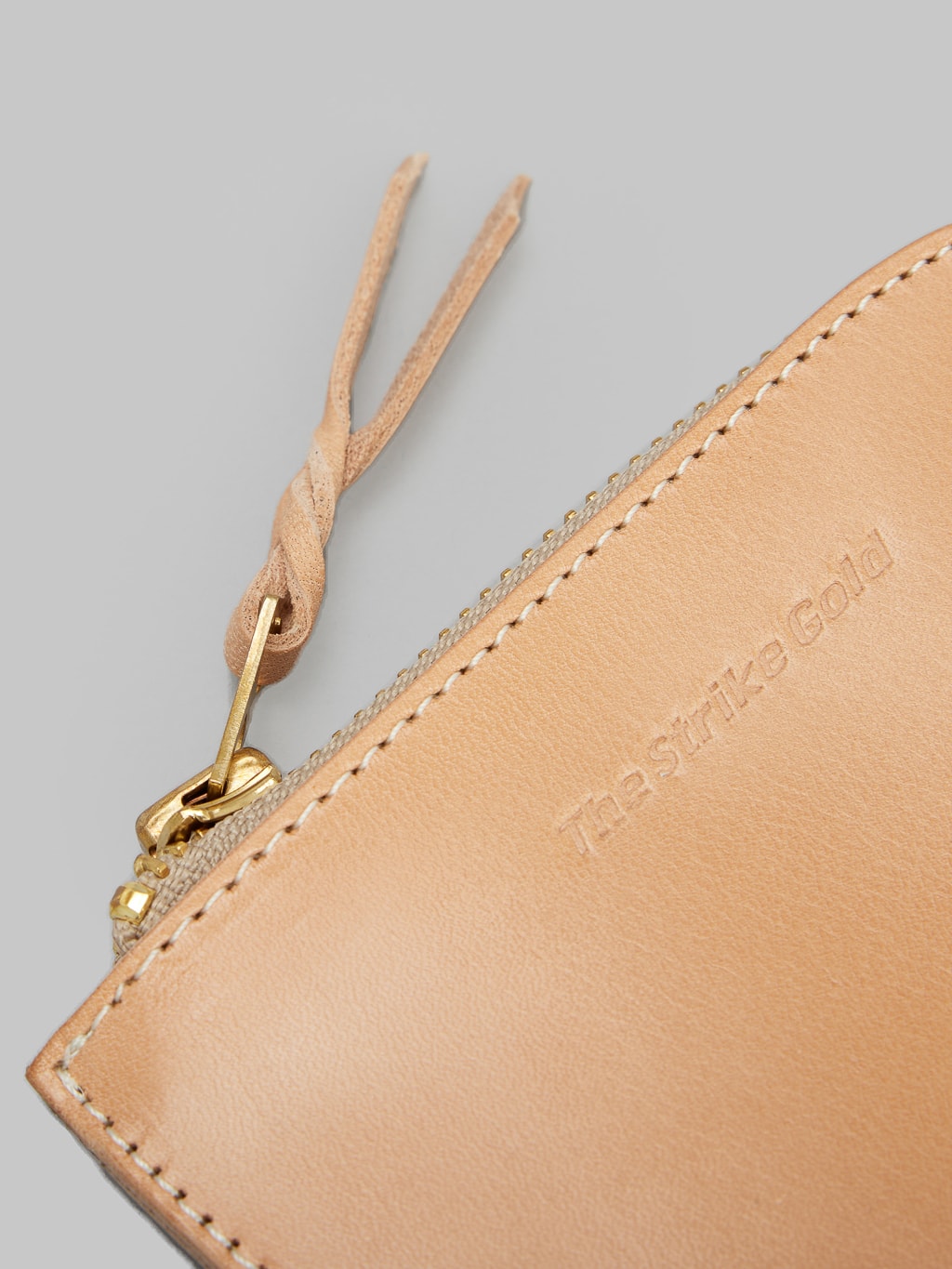 The Strike Gold Leather Zip Wallet Natural artisanal engraved logo