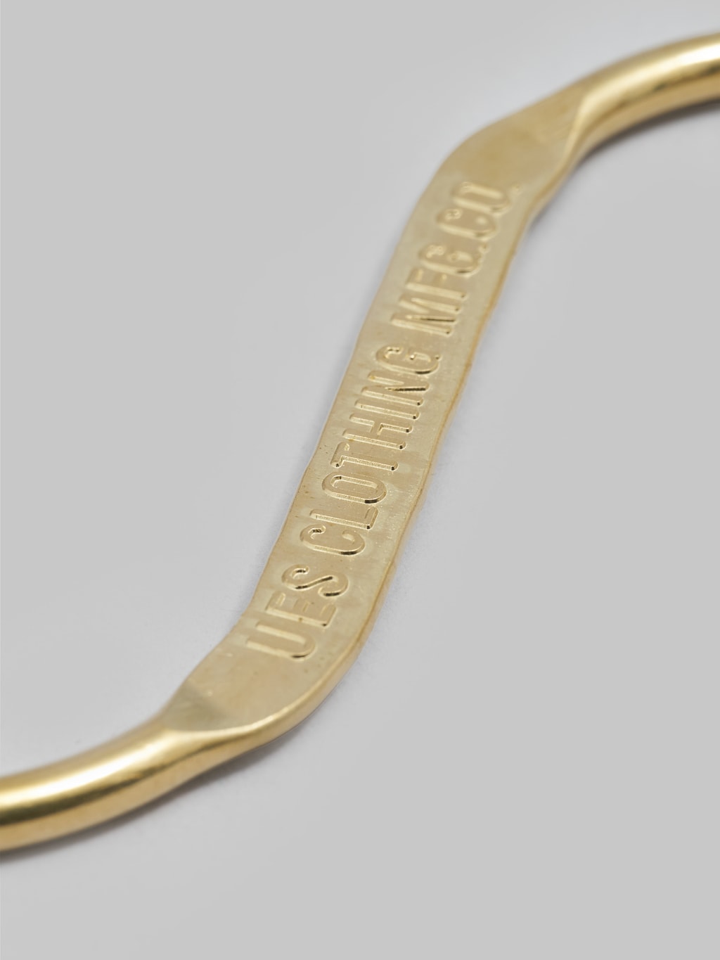 UES brass s-hook stamped logo