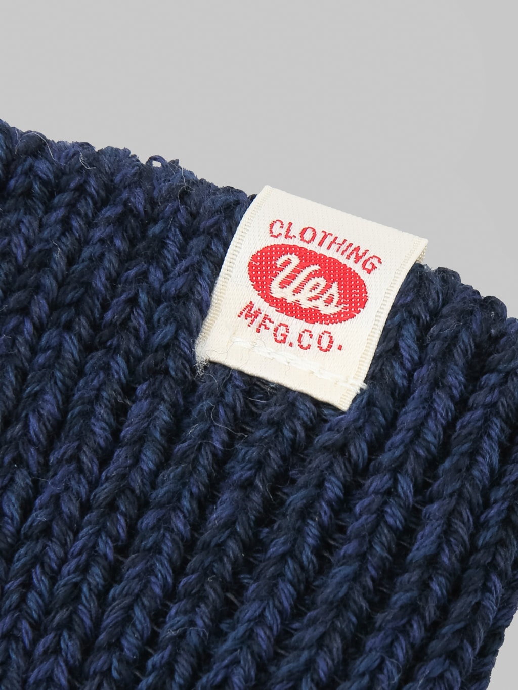 UES Crew Length Socks Navy logo tag