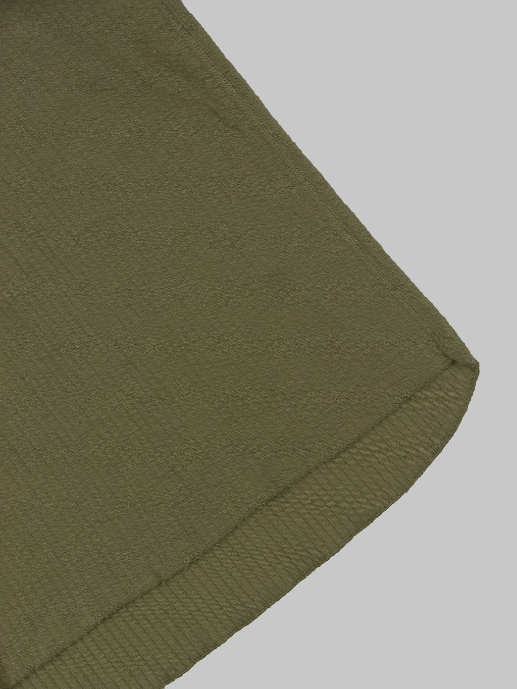 Loop Weft Double Face Jacquard henley Thermal army olive hem closeup