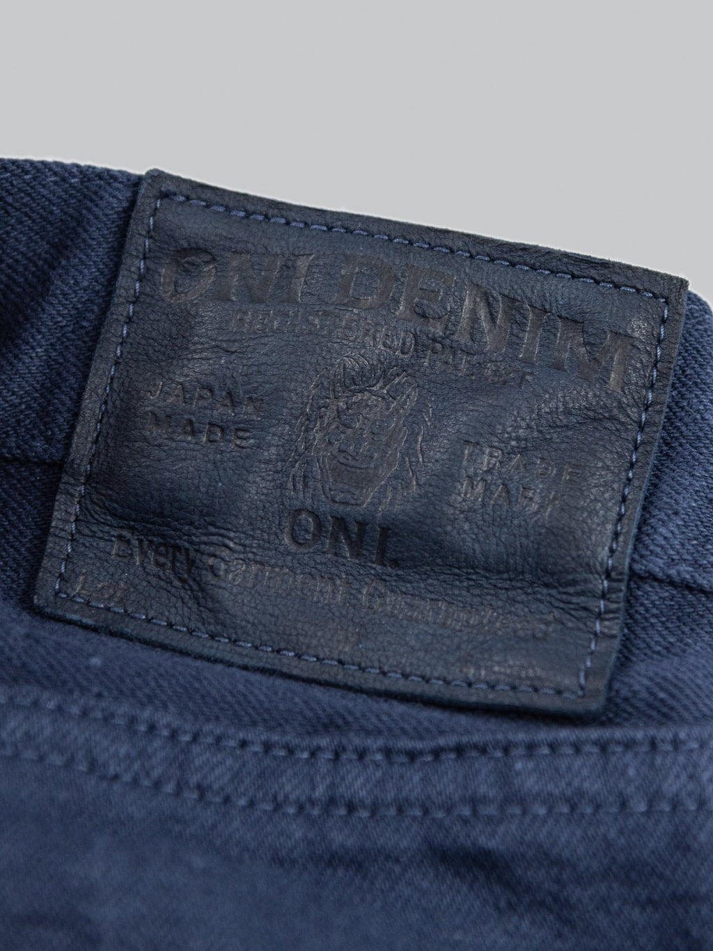 ONI Denim 612 Super Low Tension Navy Relaxed Tapered Jeans leather patch