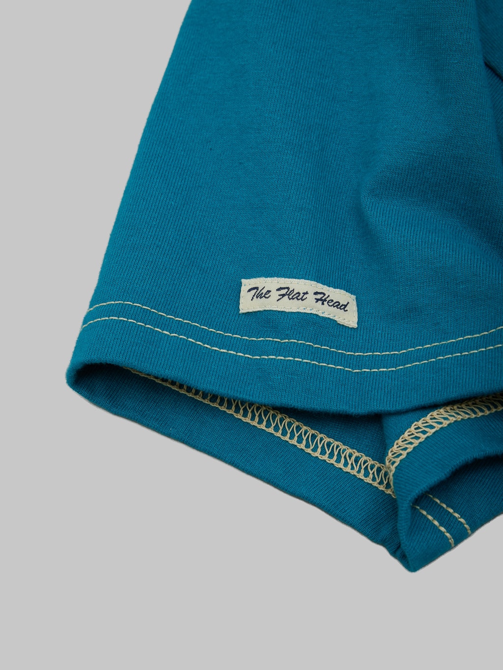 The Flat Head Plain Heavyweight TShirt turquoise sleeve tag