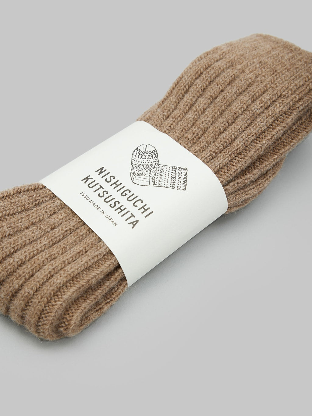 nishiguchi kutsushita praha wool ribbed socks beige front label