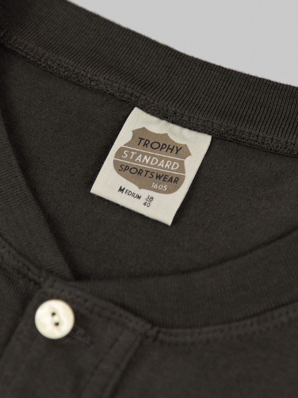trophy clothing od henley tee black interior tag