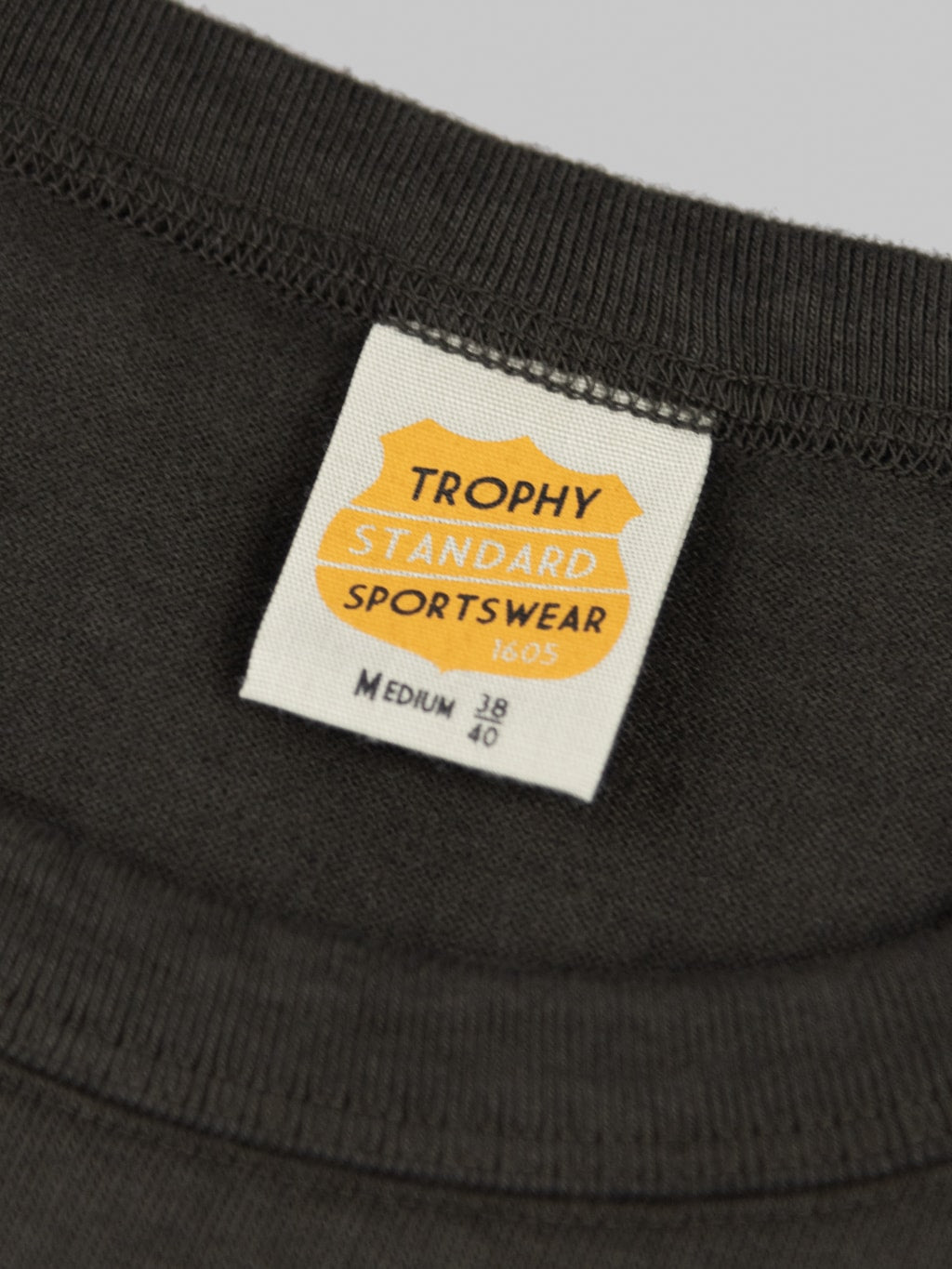 trophy clothing od pocket tee black interior tag